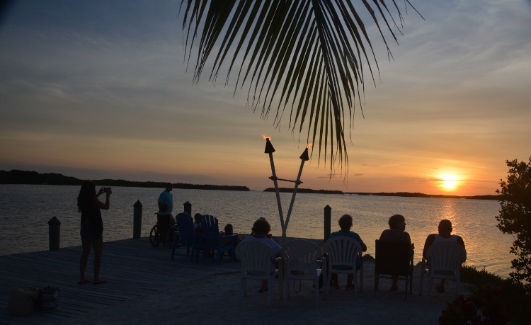 sunset with tiki torches